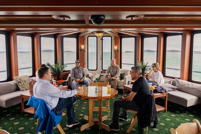 Boston Harbor Night Cruise - The onboard vibe: cozy, playful, and sometimes party-adjacent